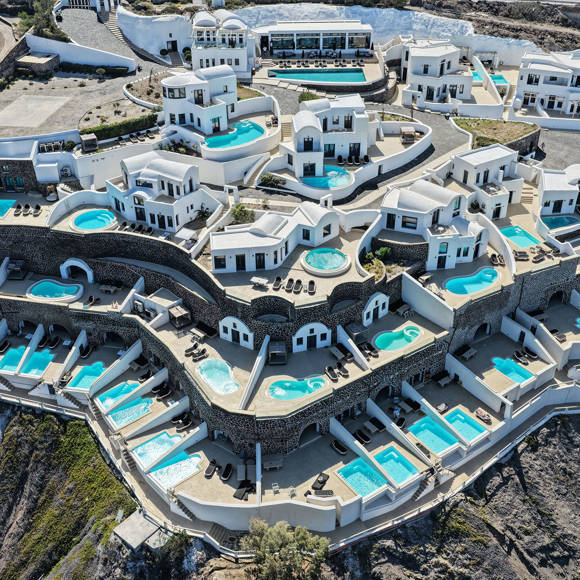 Aerial view of Grand Ambassador by Trend Hotels with luxury suites and private pools overlooking the caldera