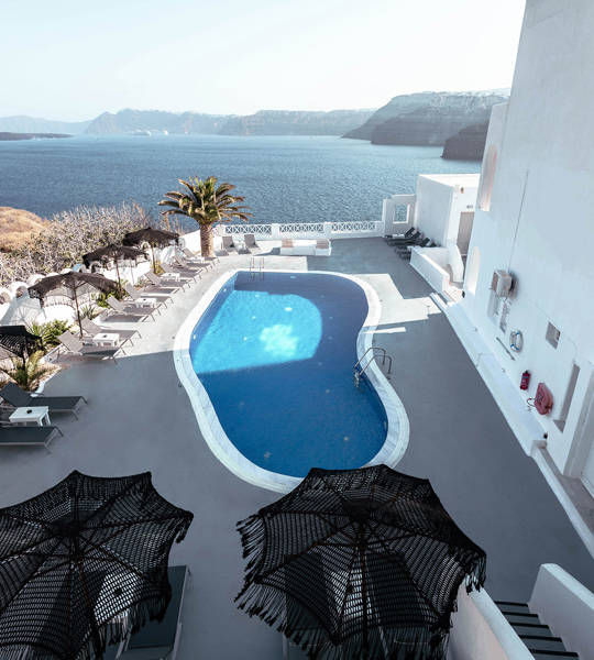 Aerial view of the pool and caldera at Santorini View Hotel by Trend Hotels in Akrotiri