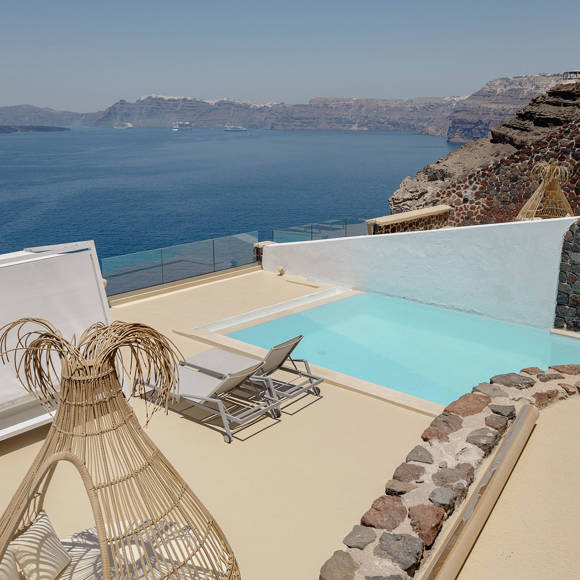 Private pool terrace at Grand Ambassador by Trend Hotels with caldera view and sun loungers in Santorini